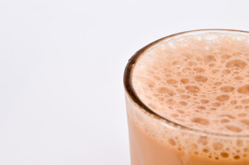 Teh tarik or pulled tea is a famous sweet milk tea in Malaysia. Bubble is floating on the surface of teh tarik.
