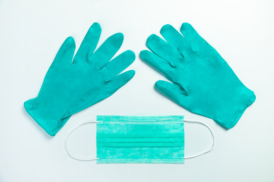 Blue medical protective mask and gloves, top view