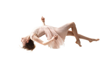 Mid-air beauty cought in moment. Full length shot of attractive young woman hovering in air and...