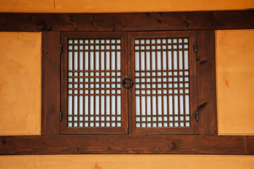 Korean traditional wooden window and brown wall