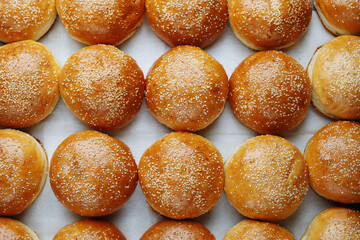 many empty burger buns. Top view. Concept photo