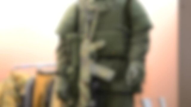 Blurred background. Mannequin dressed various body armor