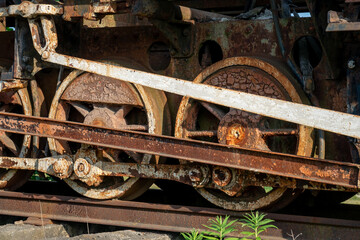 Fototapeta na wymiar Details of the old rusty train locomotive, wheel