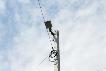 pole with electric wires in the village