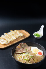 tonkotsu ramen (Japanese noodle in pork Bone based soup) and Gyozas, (fried japanese dumplings)
