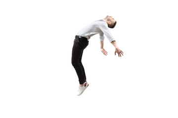 Mid-air beauty cought in moment. Full length shot of young man hovering in air and keeping eyes...