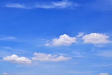 Naklejka na ściany i meble Bright blue sky with white clouds.