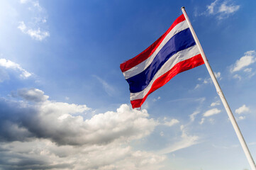 thailand national flag in blue sky and white cloud  outdoor background