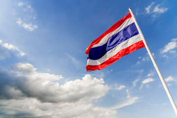 thailand national flag in blue sky and white cloud  outdoor background