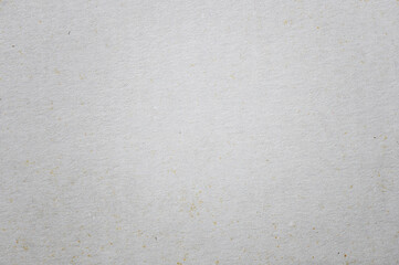 Old cardboard background texture. Closeup of white and gray paper wallpaper