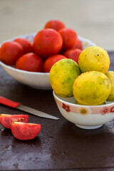 yellow organic lemons in a bowl