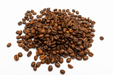 Roasted coffee beans pile isolated on white background. top view