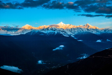 Sunrise at Snow Mountain Meili, a sacred mountain in Tibet, China.