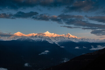 Fototapeta na wymiar Sunrise at Snow Mountain Meili, a sacred mountain in Tibet, China.