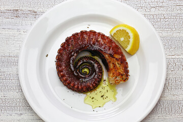 grilled octopus with lemon and olive oil, miditerranean cuisine ( Greece, Italy, Spain)