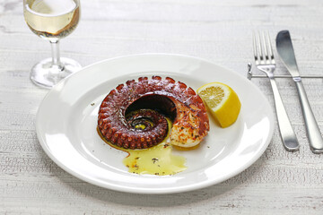grilled octopus with lemon and olive oil, miditerranean cuisine ( Greece, Italy, Spain)