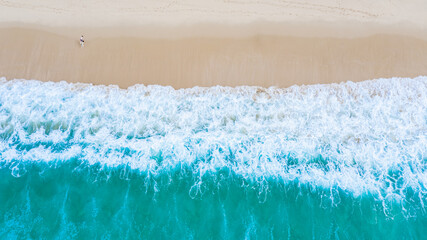 Fototapeta na wymiar emerald sea and small tourist at Surin beach, Phuket, Thailand,