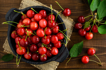 Sweet cherries in a black bowl