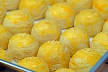 Delicious homemade Chinese pastries (mini moon cakes or bings) with mung bean and preserved egg yolk.