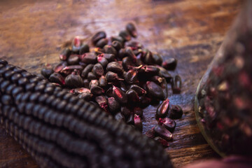 Purple corn on woden table, selective blur.