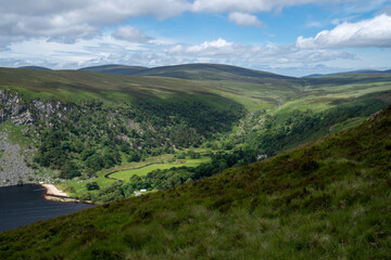 Fototapeta na wymiar Panoramic view of Wicklow Mountains. This place is famous for uncontaminated nature, misty landscapes, and lakes