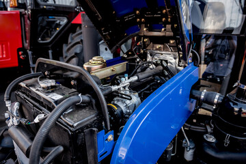 Fototapeta premium Modern new agricultural tractor engine. Machinery and equipment