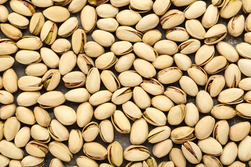 Tasty pistachios on grey background