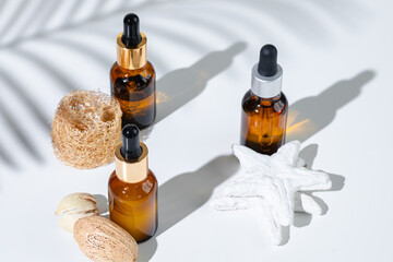 Skincare products containers on a white background with creative shadows