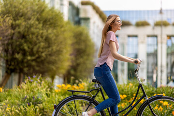 Attractive young woman going for a bicycle ride
