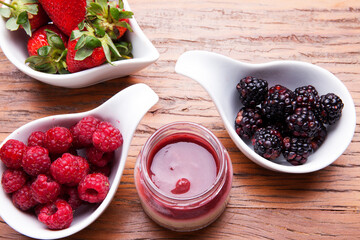 Nutrition concept - Healthy cheese cake in glass jars over wooden background. Healthy food, Diet, Detox, Clean Eating or Vegetarian concept. Delicious dessert option.
