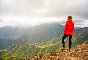 Sporty woman hiking in Anaga Mountains Taganana Tenerife, Canary island resort.