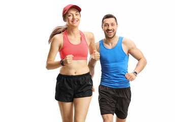 Young man and woman jogging towards camera