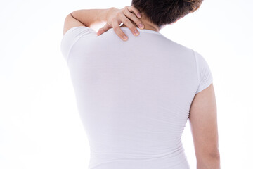 A man feeling exhausted and suffering from shoulder and neck pain and injury on isolated white background. Health care and medical concept.