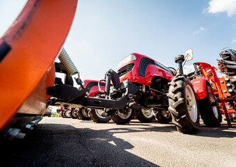 Rows of modern tractors. Industrial details. Agricultural 