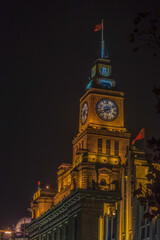 View to clock tower at Shanghai Bund at night time in summer