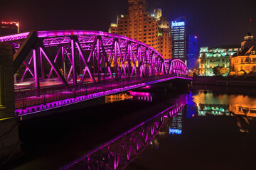 Fototapeta na wymiar View on colorful illuminated Waibaidu bridge in Shanghai at night