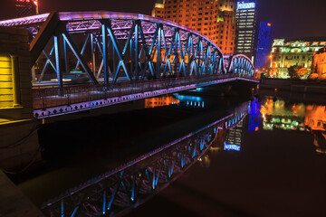View on colorful illuminated Waibaidu bridge in Shanghai at night