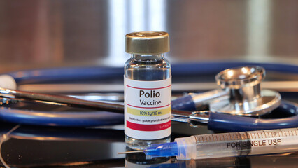 Via of Polio Vaccine on a stainless steel background