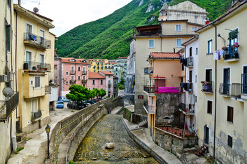 Fototapeta na wymiar A river between the old houses of the town of Campagna in the province of Salerno, Italy.