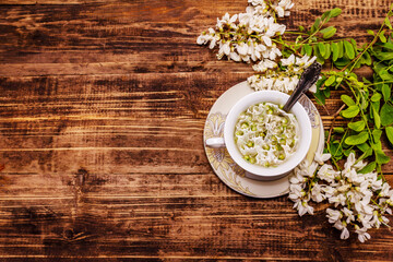 Obraz na płótnie Canvas Tea from fresh acacia petals. Hot drink, alternative medicine