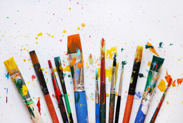 Colorful background of paint brushes, close up 