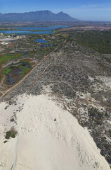 Cape Town, Western Cape / South Africa - 02/17/2016: Aerial photo of a dune with Table Mountain in the background