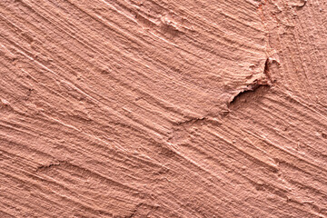 Textured smears of dark skin foundation, background