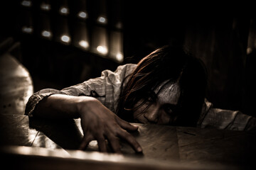 Portrait of asian woman make up ghost face with blood,Horror scene,Scary background,Halloween...