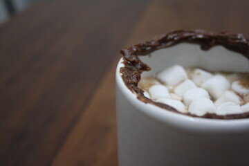 hot chocolate mug with stuffed edges and marshmallows inside