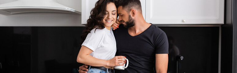panoramic shot of happy man near smiling girl holding cup of coffee