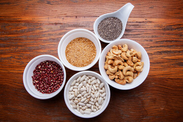 Nutrition concept -Healthy grains food selection in round bowls over wooden background. Healthy food, Diet, Detox, Clean Eating or Vegetarian concept
