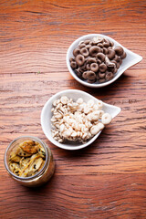 Nutrition concept - Healthy meals in glass jars over wooden background. Homemade mushroom and salad. Healthy food, Diet, Detox, Clean Eating or Vegetarian concept