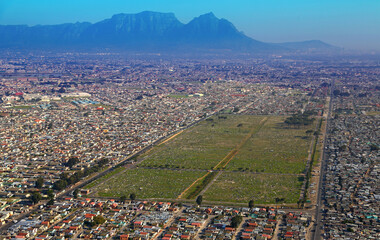 Cape Town, Western Cape / South Africa - 06/08/2016: Aerial photo of Gugulethu Cemetry with Table Mountain in the background