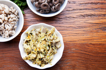 Nutrition concept - Healthy meals in glass jars over wooden background. Homemade mushroom and salad. Healthy food, Diet, Detox, Clean Eating or Vegetarian concept